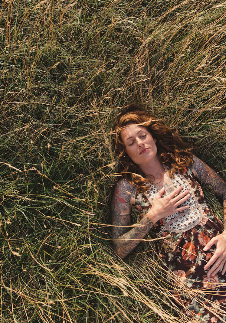 Maisie Hill -558 Maisie laying in a field of grass